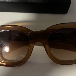 Style is unicorny in light brown.sunglasses Comes with Box and case.worn once